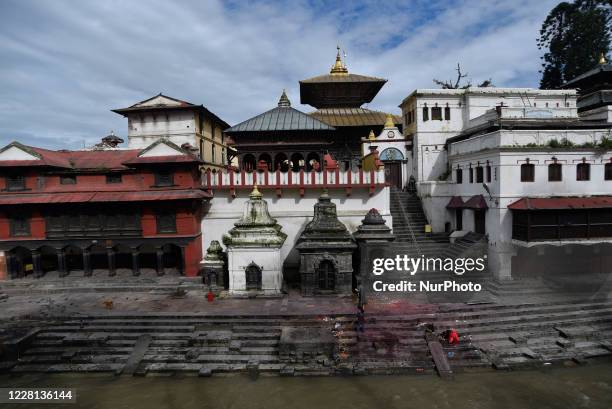 Nepalese devotee offer ritual prayer in the Bank of Bagmati River during Teej festival celebrations at Kathmandu, Nepal on Friday, August 21, 2020....