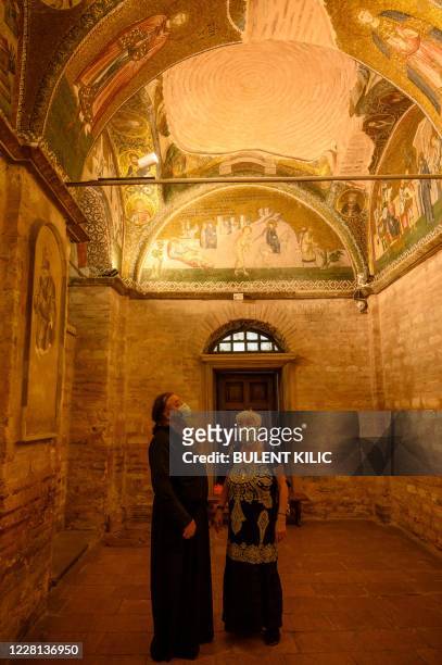 Priest and a woman visit the Chora or Kariye Museum, formally the Church of the Holy Saviour, a medieval Byzantine Greek Orthodox church, on August...