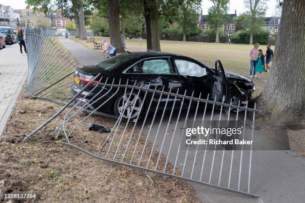 The aftermath of a crashed Audi car that has crashed through railings of Ruskin Park, a public space in Herne Hill on 21st August 2020, in London,...