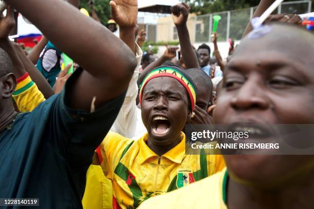 Man cheers during a protest to support the Malian army and the National Committee for the Salvation of the People in Bamako, Mali, on August 21,...