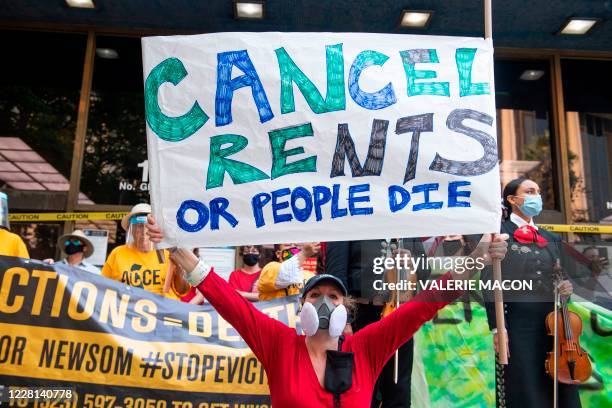 Renters and housing advocates attend a protest to cancel rent and avoid evictions in front of the court house amid Coronavirus pandemic on August 21...