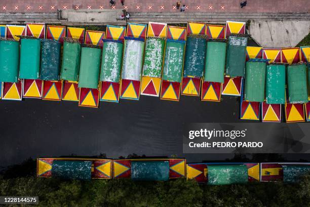 Aerial view of "trajineras" at the Cuemanco canal pier in Xochimilco, a network of canals and floating gardens that is one of Mexico City's top...