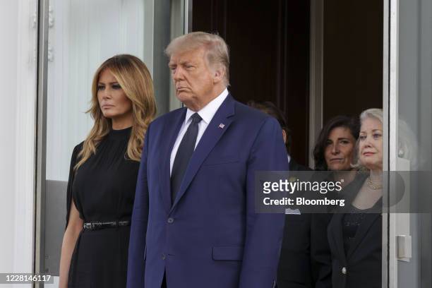 President Donald Trump and First Lady Melania Trump wait as pallbearers carry Robert Trumps casket at the North Portico of the White House following...