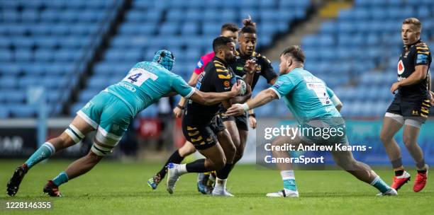 Lima Sopoaga of Wasps is tackled by James Scott and Richard Palframan of Worcester Warriors during the Gallagher Premiership Rugby match between...