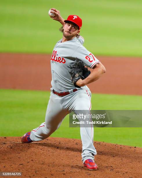 Aaron Nola of the Philadelphia Phillies delivers the pitch in the first inning of an MLB game against the Atlanta Braves at Truist Park on August 21,...