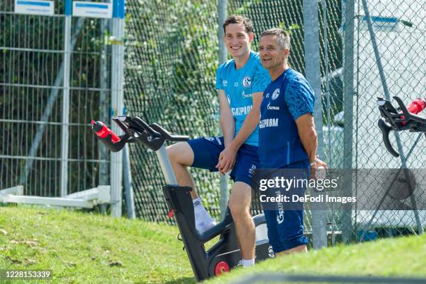 Sebastian Rudy of FC Schalke 04 and Athletikhead coach Werner Leuthard of FC Schalke 04 smiles during the FC Schalke 04 Training Camp on August 22,...