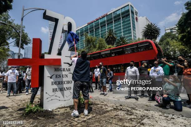 Activists place an "anti-monument" to mark the 10th anniversary of the San Fernando Massacre in which 72 migrants on route to the United States were...