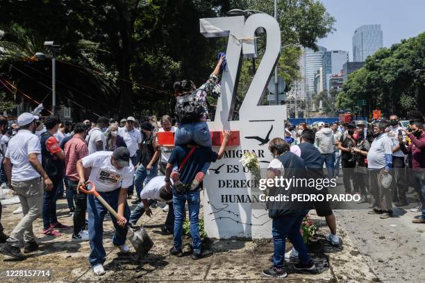 Activists place an "anti-monument" to mark the 10th anniversary of the San Fernando Massacre in which 72 migrants on route to the United States were...