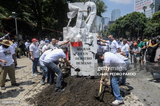 Activists place an "anti-monument" to mark the 10th anniversary of the San Fernando Massacre in which 72 migrants on route to the United States were...