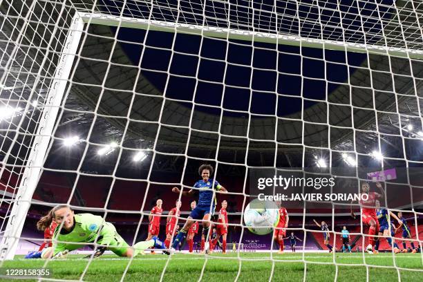 Bayern Munich's German goalkeeper Laura Benkarth concedes a second goal during the UEFA Women's Champions League quarter-final football match between...