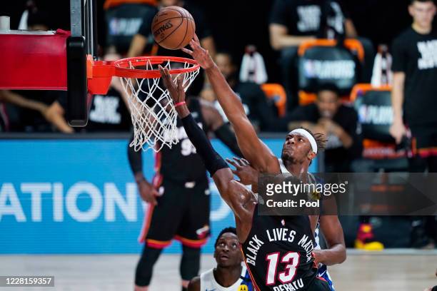 Indiana Pacers center Myles Turner blocks a shot by Miami Heat forward Bam Adebayo during the second half of an NBA basketball first round playoff...
