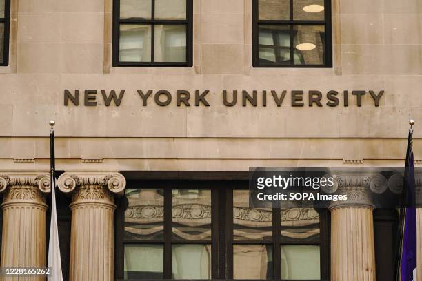 View of New York University sign on the campus building.