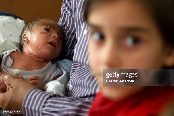 Syrian baby Mutaz who is just 18 days old with fish scale disease is seen in Sermin district of Idlib, Syria on August 22, 2020. Baby Mutaz and his...