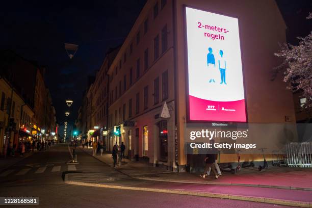 Social distancing billboard in the city centre, usually teeming with youth on the weekend, now seen deserted on August 22, 2020 in Stockholm, Sweden....