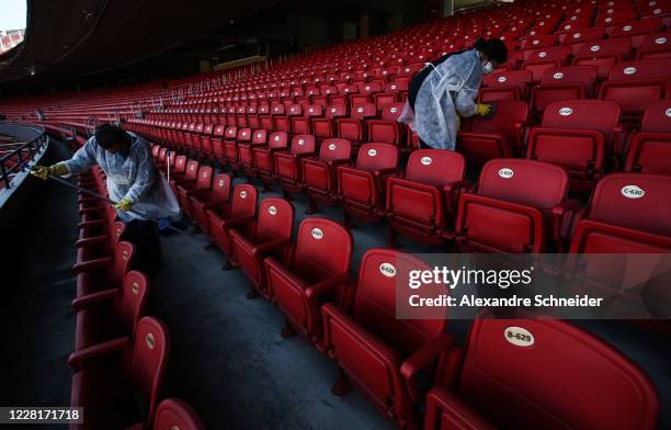 Staff members clean the stadium prior to the match between Palmeiras and Santos as part of the 2020 Brasileirao Series A at Allianz Parque on August...