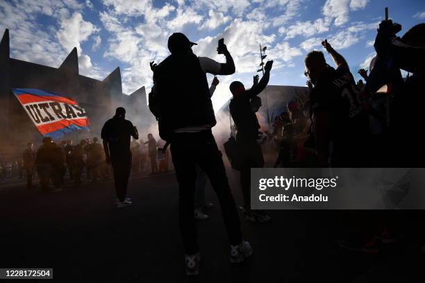 Paris Saint Germain fans and and Ultras gather near PSG's Parc de Princes Stadium as they prepare to watch and support their team play in the...