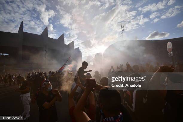 Paris Saint Germain fans and and Ultras gather near PSG's Parc de Princes Stadium as they prepare to watch and support their team play in the...