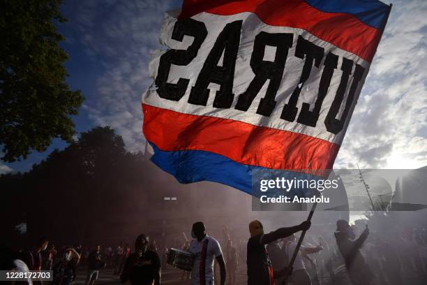 Paris Saint Germain fans and and Ultras gather near PSG's Parc de Princes Stadium as they prepare to watch and support their team play in the...