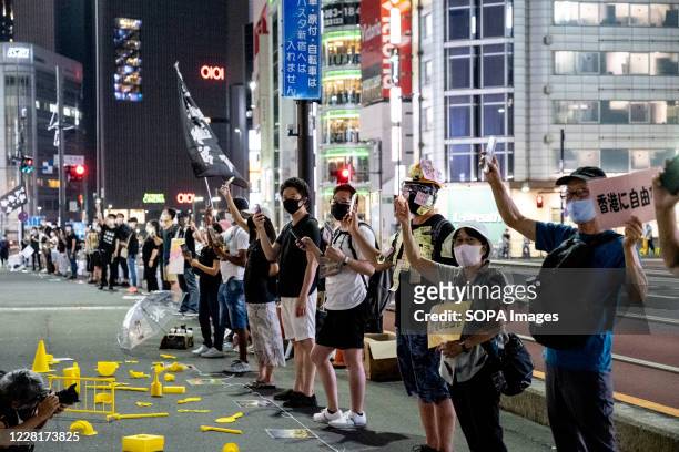 Demonstrators holding Liberate Hong Kong, revolution of our times placards and Hong Kong Independence flag during the protest. Demonstrators took to...