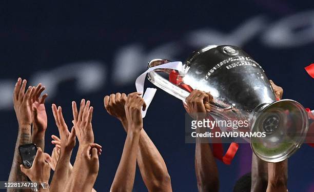 Bayern Munich's French forward Kingsley Coman and teammates celebrate after winning the UEFA Champions League final football match between Paris...