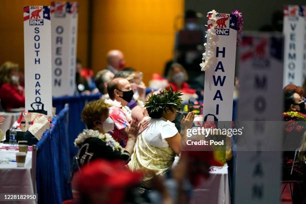 Delegates from Hawaii, give their support to President Donald Trump., on the first day of the Republican National Convention at the Charlotte...