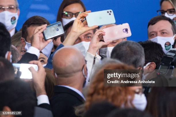 Jair Bolsonaro President of Brazil stops to take pictures after the "Brazil Vencendo a COVID" event amidst the coronavirus pandemic at the Planalto...