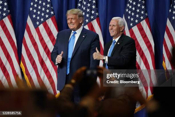 President Donald Trump and Vice President Mike Pence, right, give the thumbs up after speaking during the Republican National Convention in...