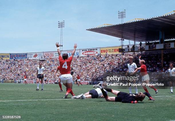 Alan Mullery of England celebrates after scoring past West Germany goalkeeper Sepp Maier during the FIFA World Cup Quarter Final at the Estadio Nou...