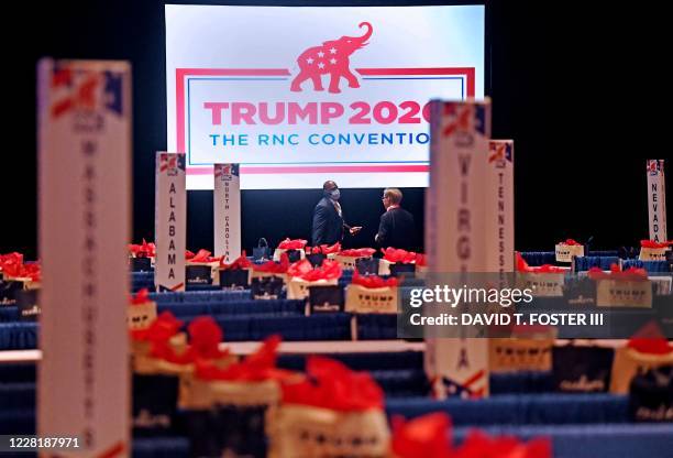 Republican National Convention delegates talk prior to the start of the first day of the Republican National Convention on August 24 in Charlotte,...