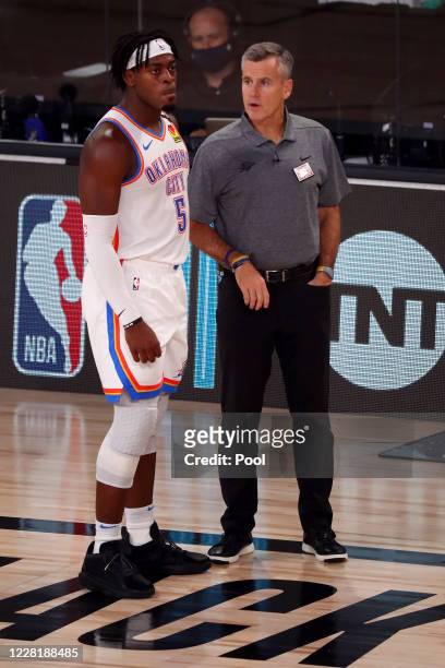 Head coach Billy Donovan of the Oklahoma City Thunder talks with Luguentz Dort during the second half of game four against the Houston Rockets of the...