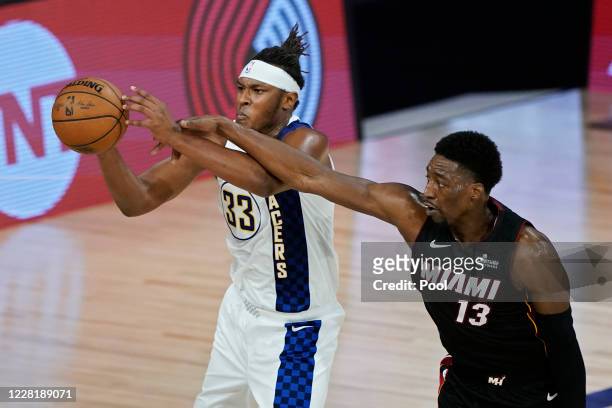 Bam Adebayo of the Miami Heat guards Myles Turner of the Indiana Pacers during the second half of a first round playoff game at The Field House at...