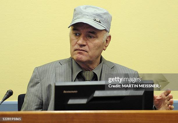 Wartime Bosnian Serb army chief Ratko Mladic sits in the court during his initial appearance at UN war crimes tribunal in The Hague, Netherlands, on...