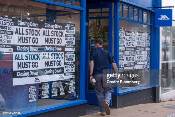 Shopper enters a Trespass clothing store, operated by Jacobs & Turner Ltd, promoting a closing down sale in Guildford, U.K. On Monday, Aug. 24, 2020....