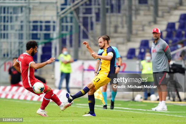 Mohamed Salah of Liverpool attacks Andreas Ulmer of Salzburg during the friendly match between FC Red Bull Salzburg and FC Liverpool at Red Bull...