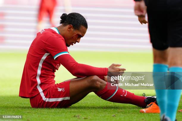 Virgil van Dijk of Liverpool suffered a bloody cut during the friendly match between FC Red Bull Salzburg and FC Liverpool at Red Bull Arena on...