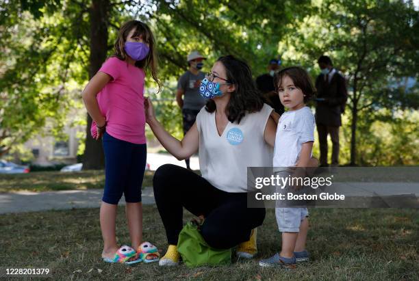 Natalia Linos, a Democrat vying for the fourth Congressional Democratic nomination in the primary race, speaks to her children following a rally held...