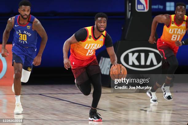 Orlando, FL Emmanuel Mudiay of the Utah Jazz handles the ball against the Denver Nuggets during Round One, Game Three on August 21, 2020 in Orlando,...