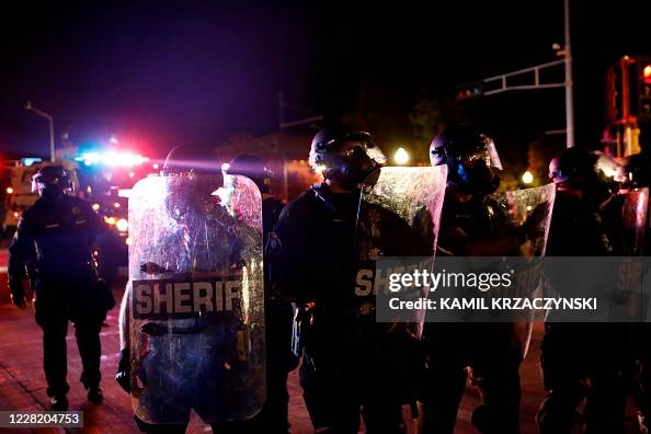 Sheriff Riot Sheriff and police in riot gear face off with protestors outside the ...