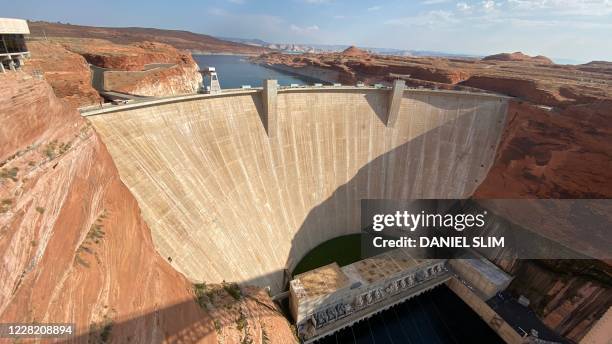 The Glen Canyon Dam, near the town of Page Arizona, is viewed on August 25, 2020. - Glen Canyon Dam is a 710-foot high dam which forms Lake Powell,...