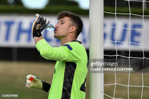 Real Madrid's goalkeeper Luis Lopez drinks during the UEFA Youth League 2019/2020 final football match between Benfica and Real Madrid on August 25,...