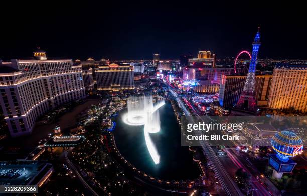 The Las Vegas Strip lights up after sunset in Las Vegas, Nev., on Sunday, Aug. 23, 2020.