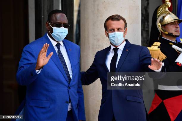 French President Emmanuel Macron receives Senegal President Macky Sall at the Elysee Palace in Paris on August 26, 2020.