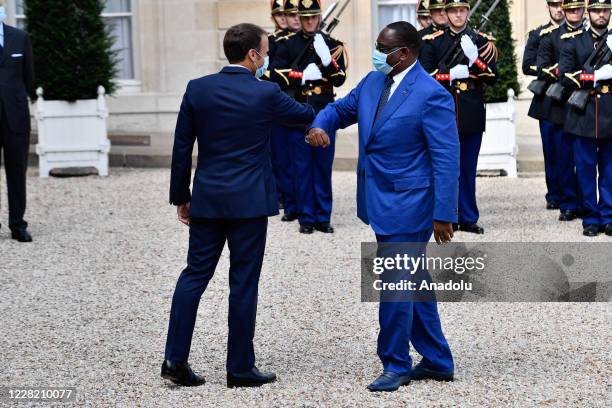 French President Emmanuel Macron receives Senegal President Macky Sall at the Elysee Palace in Paris on August 26, 2020.