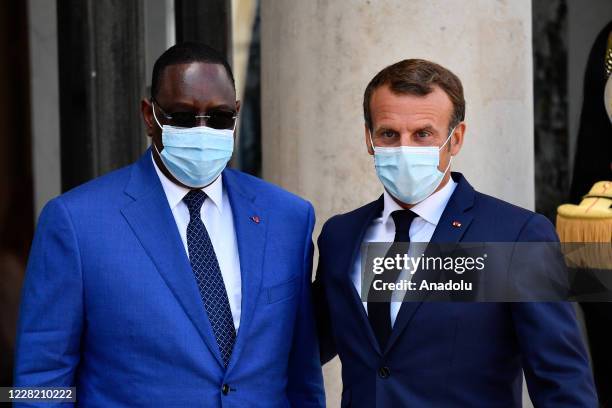 French President Emmanuel Macron receives Senegal President Macky Sall at the Elysee Palace in Paris on August 26, 2020.