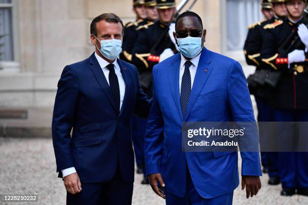 French President Emmanuel Macron receives Senegal President Macky Sall at the Elysee Palace in Paris on August 26, 2020.