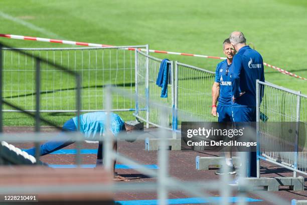 Atheltic coach Werner Leuthard of FC Schalke 04 and Vorstand Sport Jochen Schneider of FC Schalke 04 speaks with during the FC Schalke 04 Training...