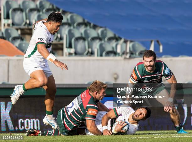 Curtis Rona of London Irish is tackled by Tom Youngs of Leicester Tigers during the Gallagher Premiership Rugby match between Leicester Tigers and...