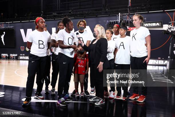 Ariel Atkins and members of the Washington Mystics talks with Holly Rowe of ESPN at Feld Entertainment Center on August 26, 2020 in Palmetto,...