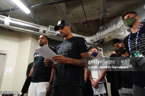 George Hill of the Milwaukee Bucks reads a statement to the media on August 26, 2020 at AdventHealth Arena at ESPN Wide World of Sports Complex in...