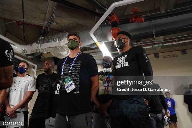 Kyle Korver and Giannis Antetokounmpo of the Milwaukee Bucks during the statement to the media on August 26, 2020 at AdventHealth Arena at ESPN Wide...